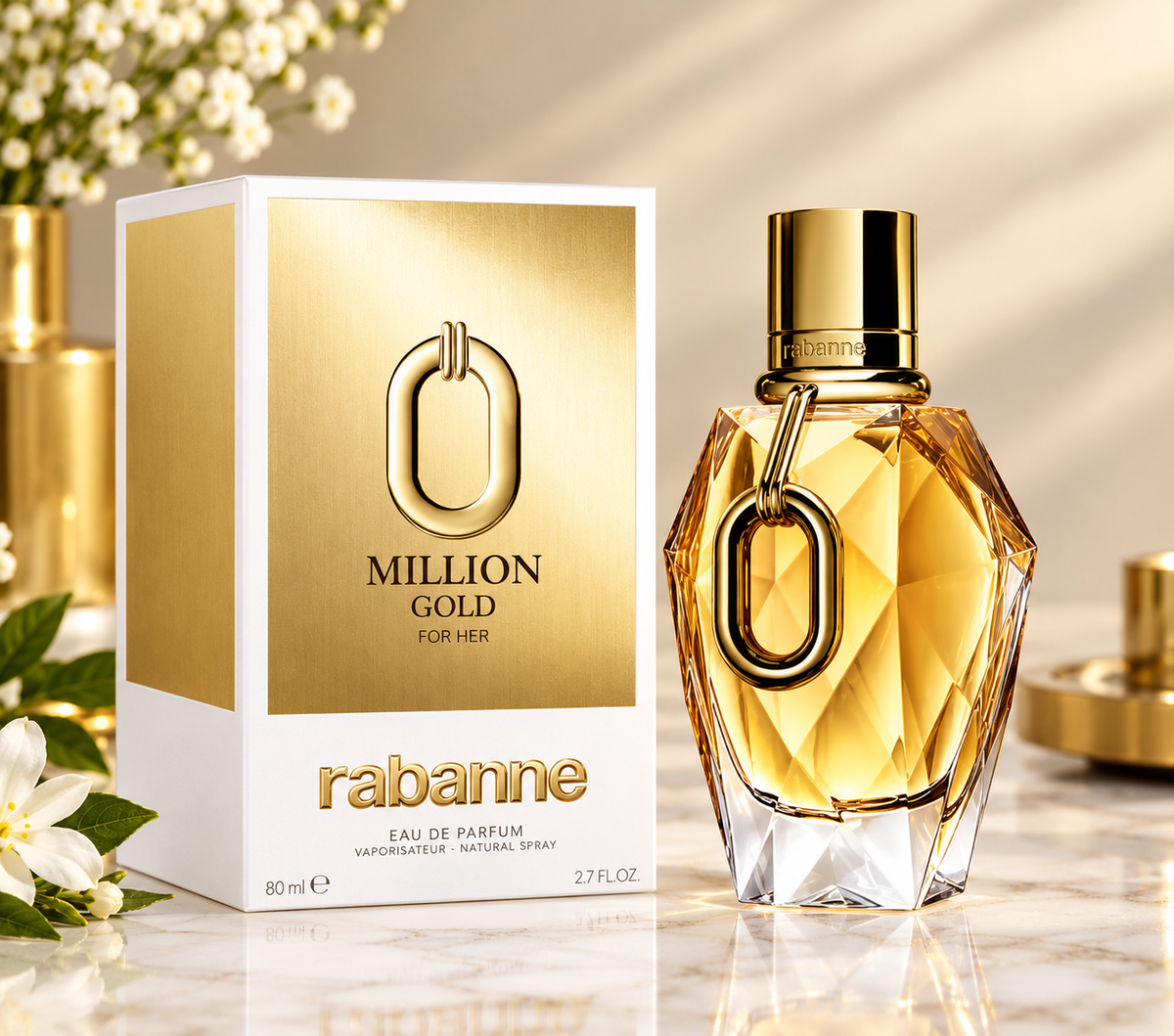 Rabanne Million Gold For Her Eau de Parfum bottle and its packaging box, displayed on a marble surface with elegant gold and white decorative elements in the background.
