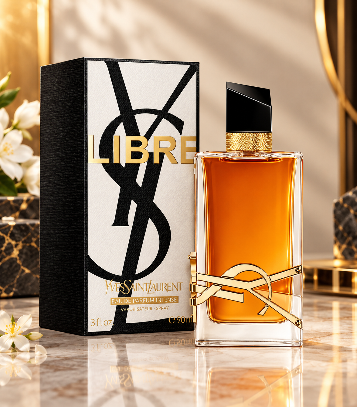 YSL Libre Eau de Parfum bottle with amber liquid and gold logo detail, shown next to its black and white packaging box with gold lettering on a polished marble surface.