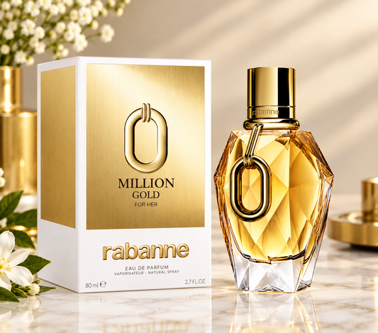 Rabanne Million Gold For Her Eau de Parfum bottle and its packaging box, displayed on a marble surface with elegant gold and white decorative elements in the background.
