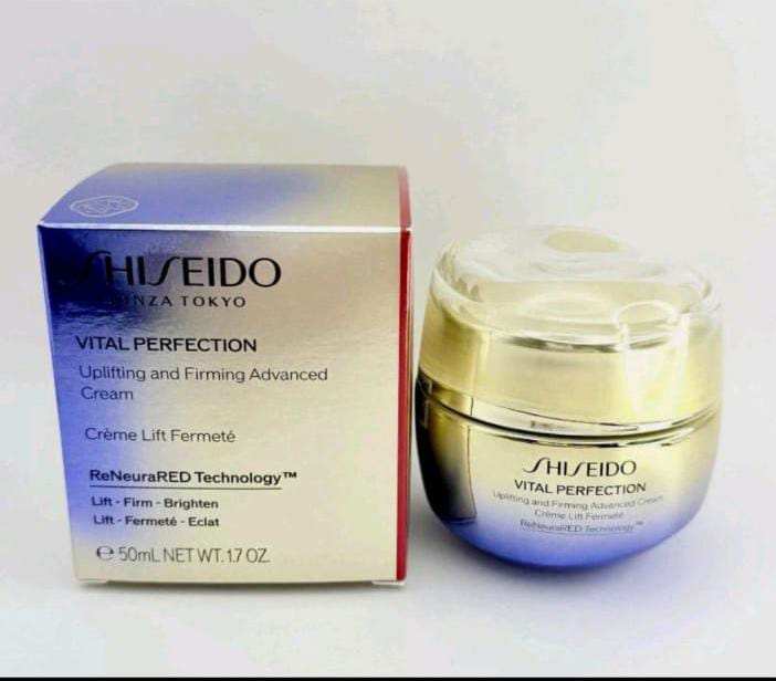 Shiseido Vital Perfection Uplifting and Firming Advanced Cream 50ml jar next to its original packaging box, displayed on a light neutral background.