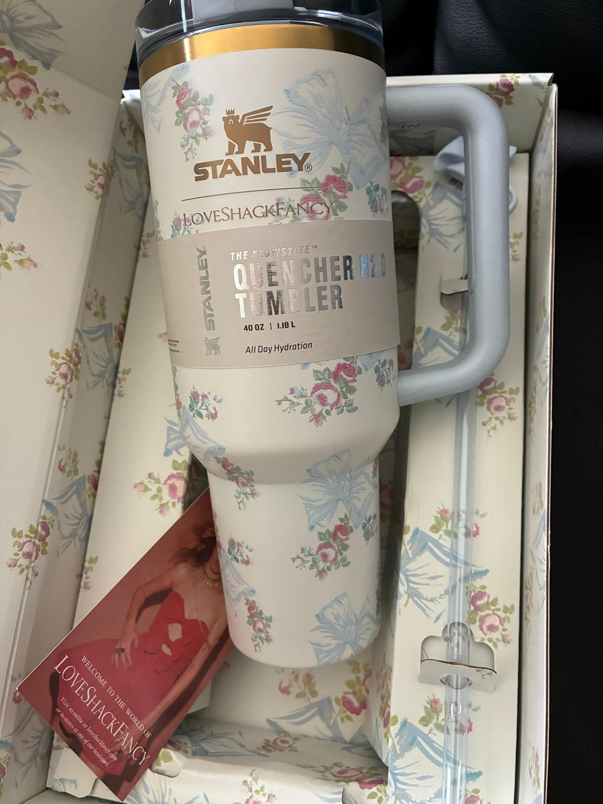 A white ceramic coffee mug with a handle, featuring a vintage-style illustration of a horse-drawn carriage and the text 'The Great Western Route'. The mug is shown inside its original retail packaging, which includes a red and white box.
