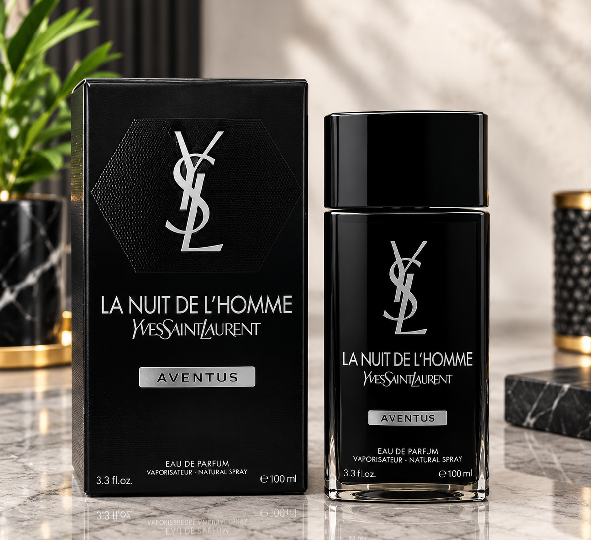 Yves Saint Laurent La Nuit de L'Homme Aventus Eau de Parfum 100ml bottle and its black packaging box, displayed on a marble surface with a softly blurred background.